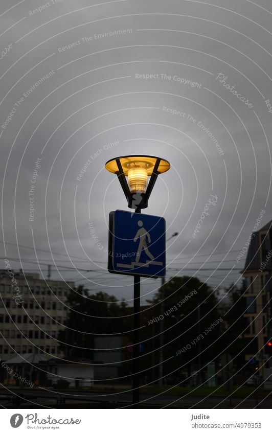 Riga, Latvia, September 11, 2022: streetlight burns to illuminate pedestrian underpass Antique Architecture atmospherically background Bad weather Blue