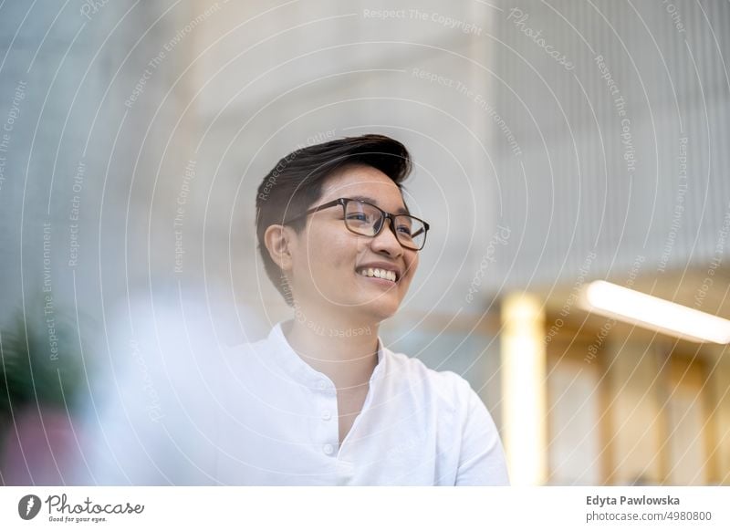 Portrait of a smiling young man in the office real people natural young adult city urban student positive smile cheerful career confident successful