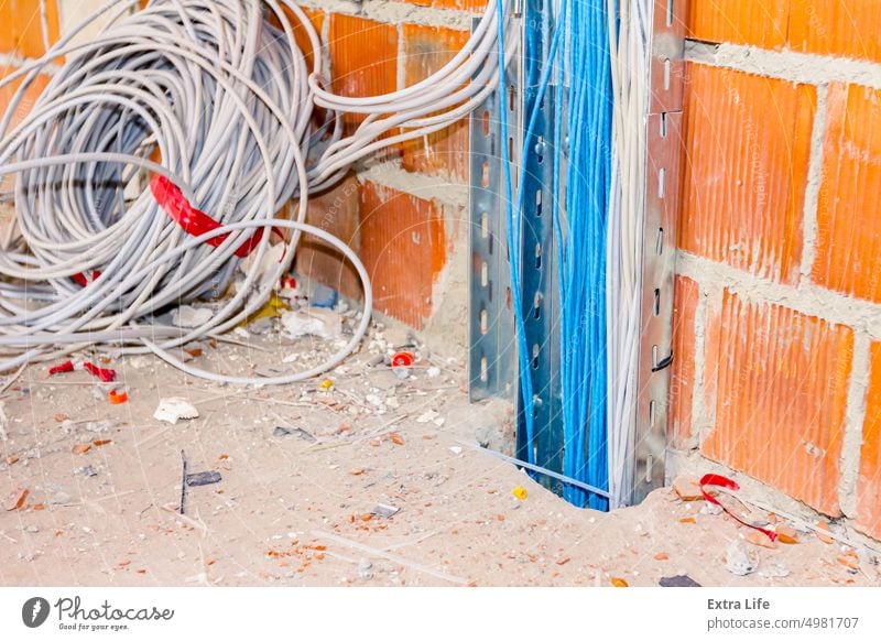 Cable tray with installation cables between floors in building Block Brick Building Site Bundle Cabling Circuit Communication Concrete Conductor Connect