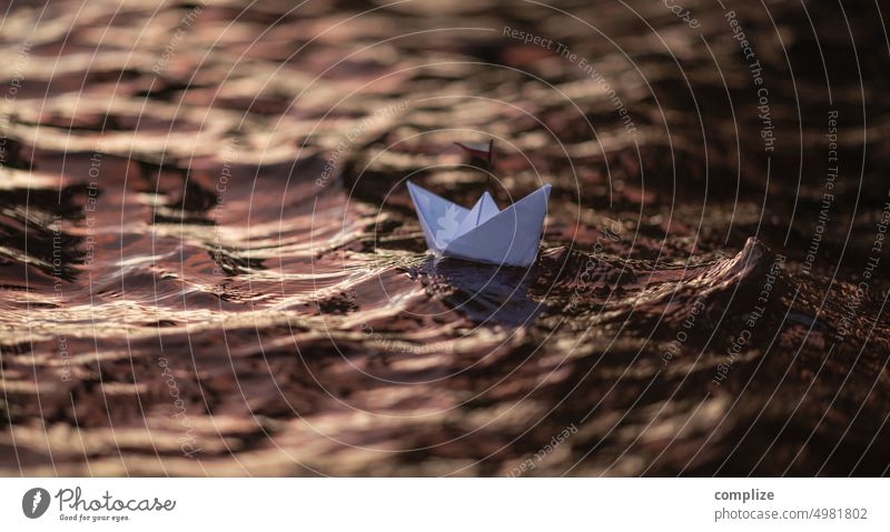 Paper ship at dusk on a lake lappajärvi Lake Paper boat Waves Sailing Sailboat Swell Sunset Romance vacation voyage travel Origami Handicraft Adventure children