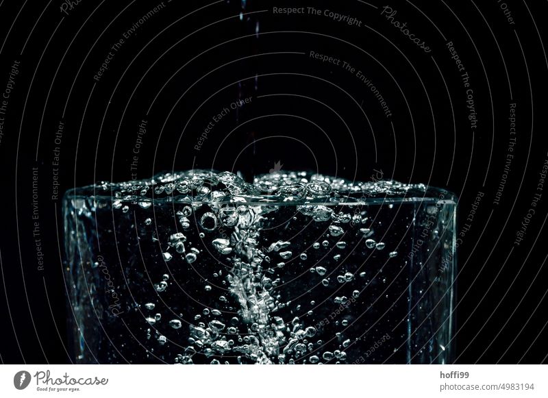 Drops fall into the water and leave traces Drops of water Water Hover Inject Surface of water Flash photo To fall Black Refraction hovering Glittering Abstract