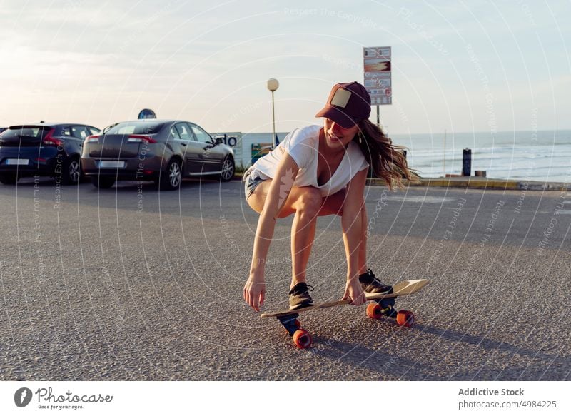 Beautiful skater practicing riding skate board on street woman skateboard fun urban beautiful young trendy stylish youth skateboarder lifestyle girl summer