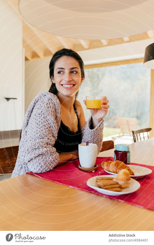 Young woman having breakfast cup window room hispanic lady attractive mug drink young big beautiful court cozy home rest relax beverage liquid lovely charming