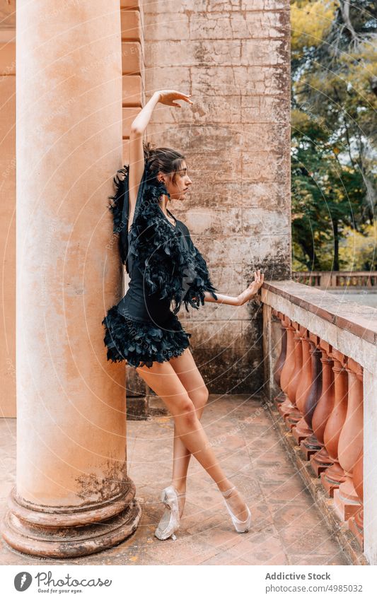 Young ballerina posing with a black dress woman dancer young shoes ballet people modern female pointe girl artist elegance classical performer grace tiptoe