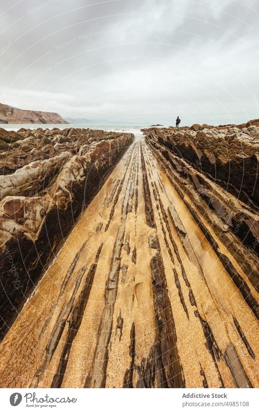 Coastal landscape of Zumaya beach basque country spain zumaia geology travel flysch man tourist sea coast nature unesco zumaya ocean rock shore coastline cliff