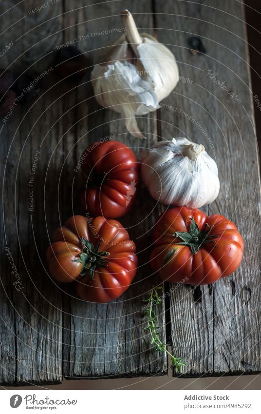 Tomatoes with garlic bulbs tomatoes fresh ingredients cooking cuisine nutrition health delicious vegetables spice ripe tasty vitamin organic culinary green