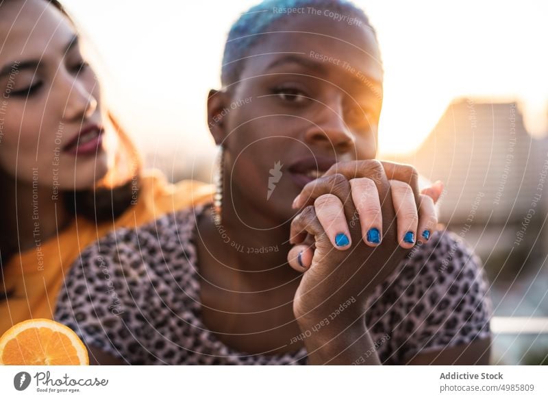 Multi ethnic lesbian couple relaxing with cocktails stylish relationship date lgbt homosexual together young multi ethnic multiracial asian female beautiful