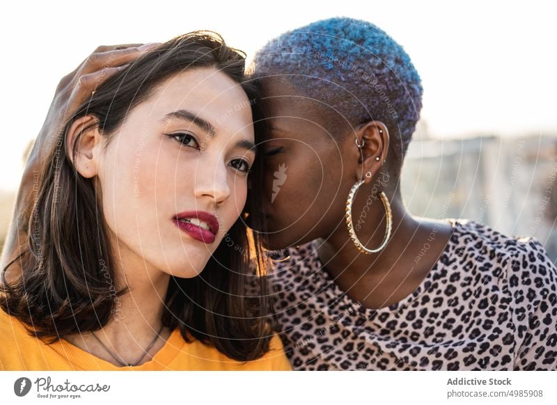 Multi ethnic lesbian couple hugging outdoors affection bonding touch lgbt homosexual togetherness young multi ethnic multiracial asian female beautiful