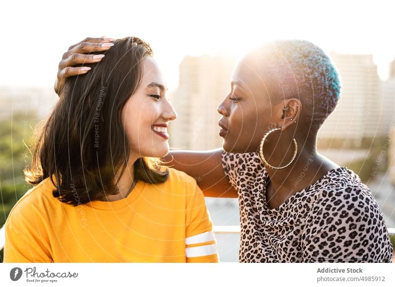 Multi ethnic lesbian couple hugging outdoors affection bonding touch lgbt homosexual togetherness young multi ethnic multiracial asian female beautiful