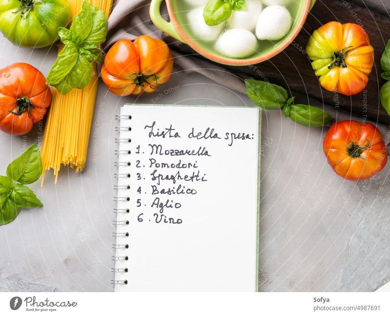 Italian food tomato mozzarella still life italian cuisine cheese cook uncooked caprese salad pasta spaghetti sauce list shopping local gray rustic wooden board