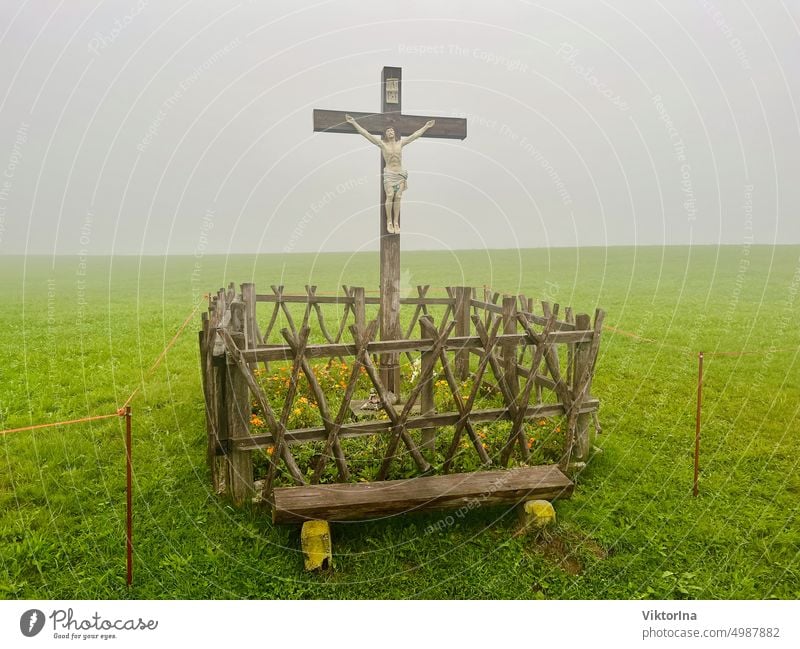 Cross on a meadow in the fog Fog herbs Crucifix Jesus Meadow Belief October November Wandereg mountain Hope Fence God Christianity Religion and faith Church