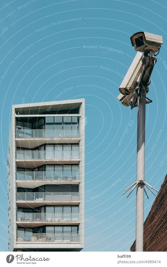 Surveillance camera with skyscraper in background surveillance camera High-rise Surveillance device Video camera Testing & Control Safety Information Technology