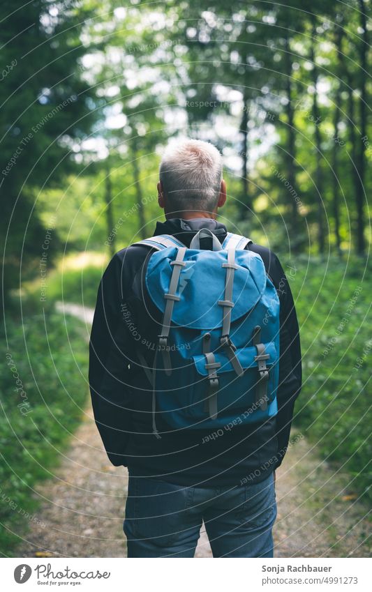 Back view of man with backpack in forest Man Backpack Hiking Forest Rear view Nature Human being Trip Vacation & Travel Freedom Adventure Tourism