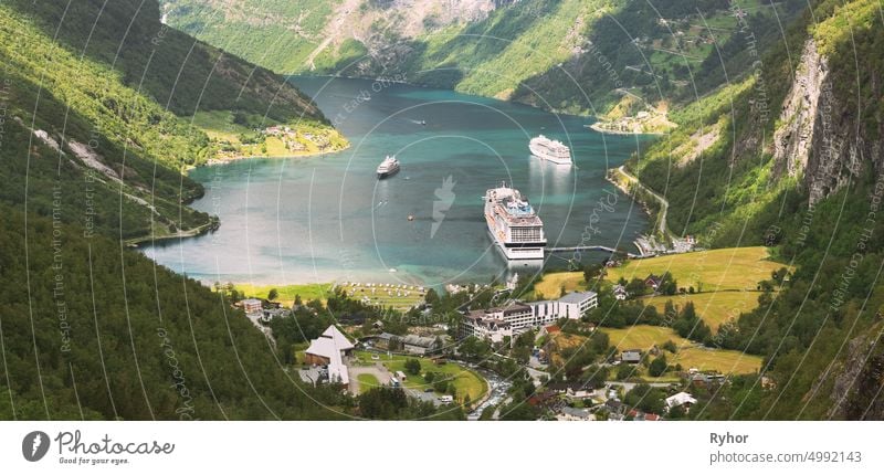 Geirangerfjord, Norway. Aerial View Of Geiranger In Geirangerfjorden In Summer Day. Touristic Ship Ferry Boat Liner Moored Near Geiranger. Famous Norwegian Landmark And Popular Destination