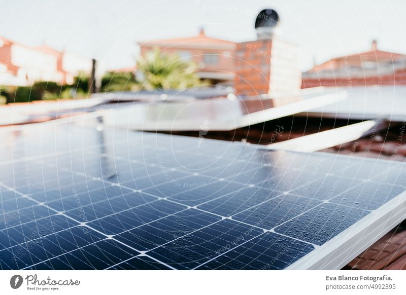 water drops on solar panel on roof during sunrise.Renewable energies and green energy concept house daytime landscape plant exterior technology field country