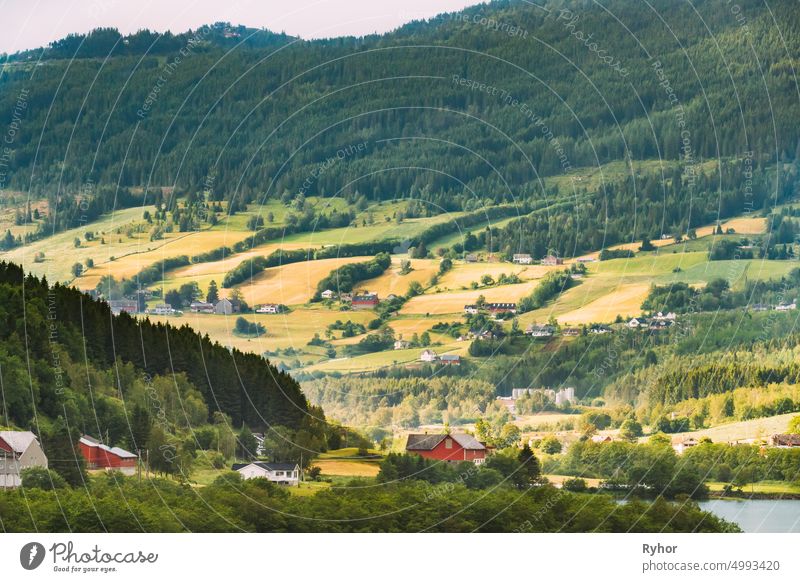 Byrkjelo Village, Sogn Og Fjordane County, Norway. Beautiful Sky Above Norwegian Rural Landscape. Bergheimsvatnet Lake In Summer Day. Agricultural And Weather Forecast Concept