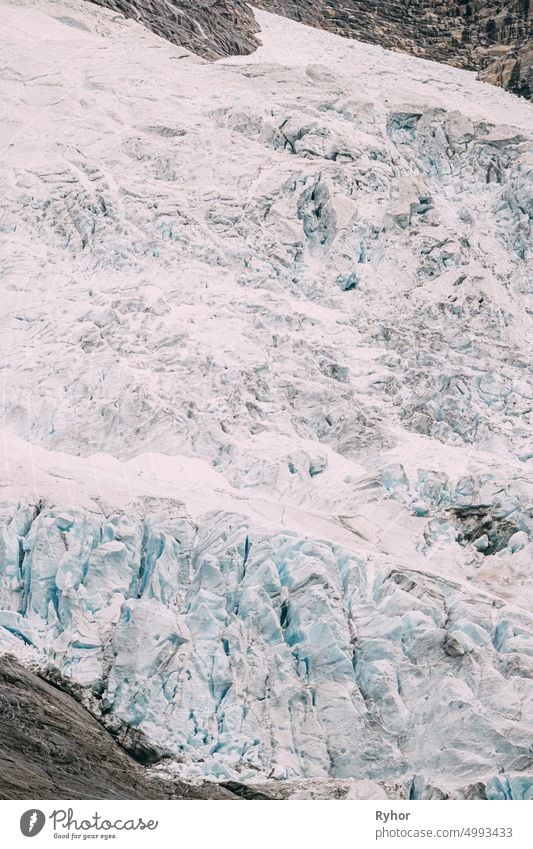 Jostedalsbreen National Park, Norway. Close Up View Of Melting Ice And Snow On Boyabreen Glacier In Summer Sunny Day. Famous Norwegian Landmark And Popular Destination. Close Up