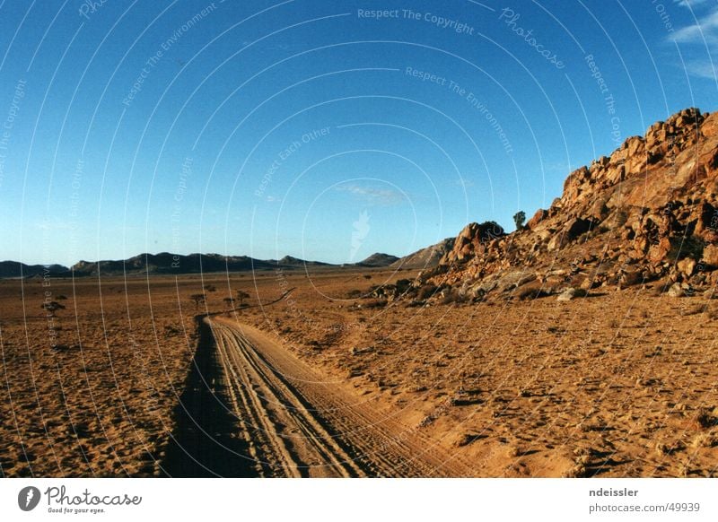 Somewhere in Africa. Namibia Loneliness Adventure Wilderness Outback Desert Lanes & trails Gloomy Empty Blue sky Freedom Namib desert Far-off places