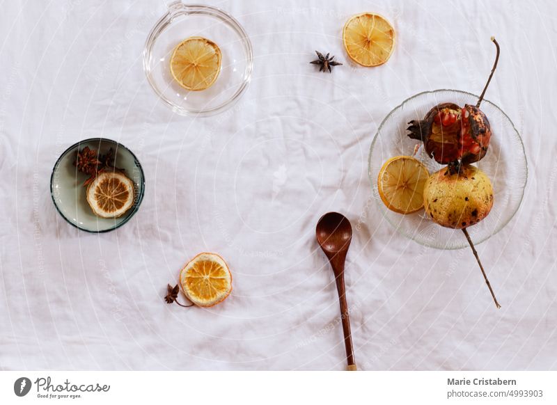 Overhead view of pomegranate fruit and dried lemon slices for making fresh juice, showing an autumn theme aesthetic background Pomegranate Directly Above