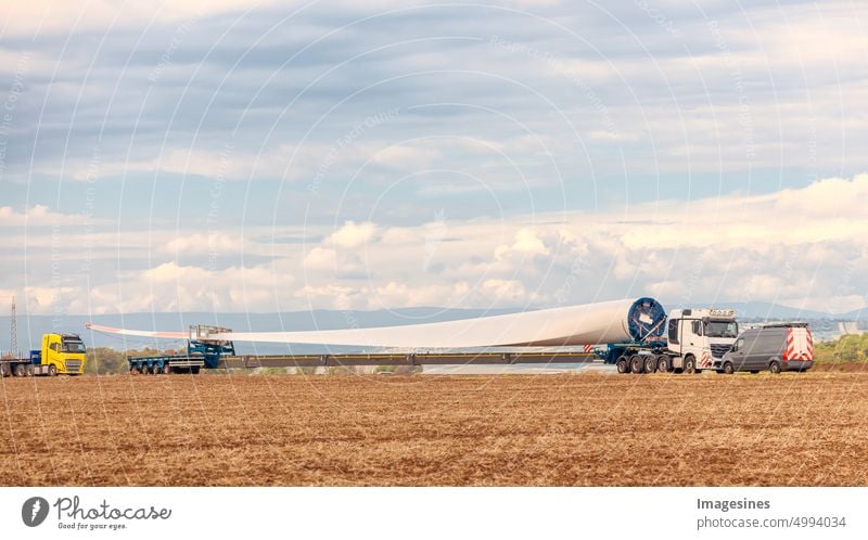 Wind turbines under construction. Transport of a blade for wind turbine. Special transport of a blade, rotor blade for a wind turbine on a truck special trailer in Rhineland-Palatinate, Wörrstadt, Germany.