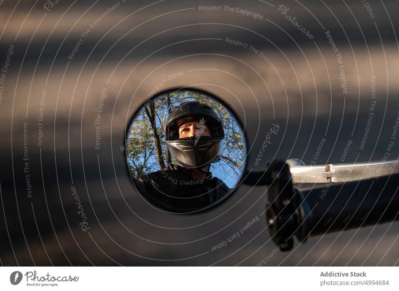 Reflection Of Motorcyclist In Side Bike Mirror travel blur active adrenaline adult adventure bike black brutal copy space drive extreme freedom gear glass