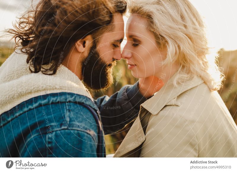 Loving couple touching noses in countryside touch nose smile love date romantic weekend together affection aviles asturias spain fondness boyfriend girlfriend