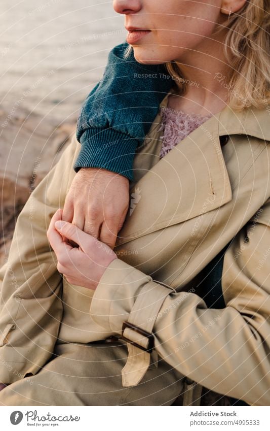 Couple resting on rocky seashore couple hug stone love date together relationship weekend aviles asturias spain admire outerwear weather cloudy traveler embrace