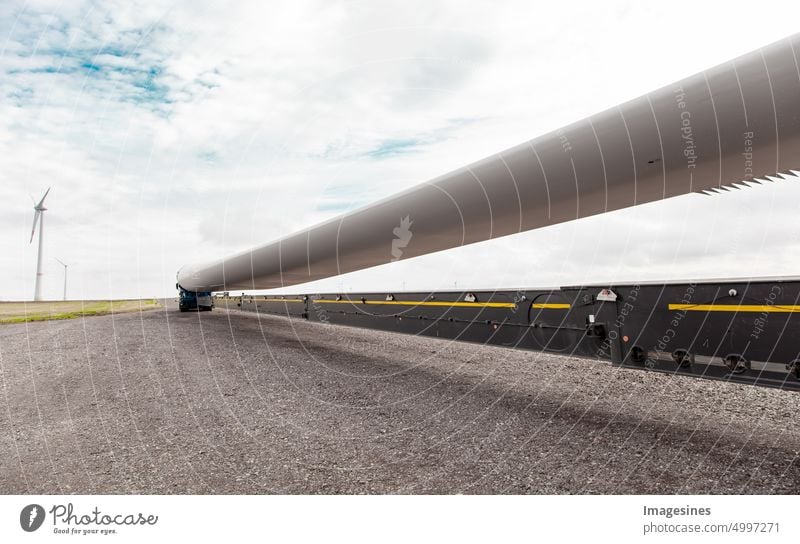 Wind turbines under construction. Transport of a blade for wind turbine. Special transport of a blade, rotor blade for a wind turbine on a truck special trailer in Rhineland-Palatinate, Wörrstadt, Germany.