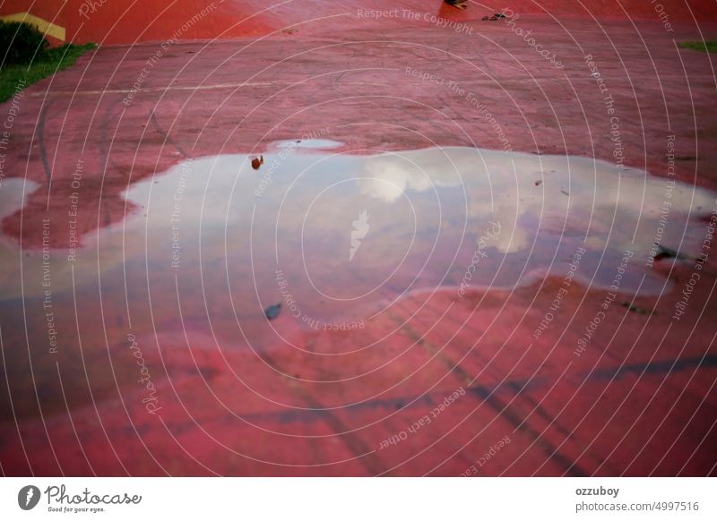 Sky reflection in rain puddle at park water weather wet nature background outdoor travel drop road sky day landscape spring street grey no people storm