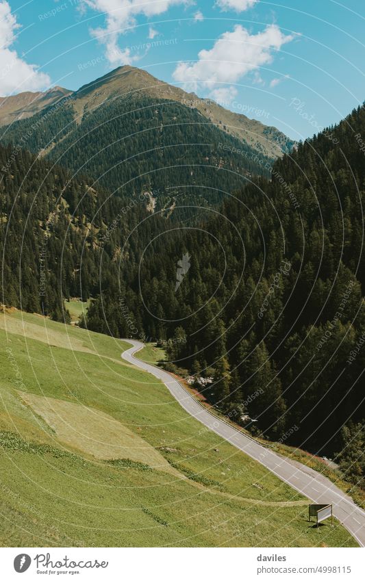 Road crossing the border in the Alps, from Austria to Switzerland, in Samnaun. Swtzerland accommodation alpine alps austria countryside europe forest green hill