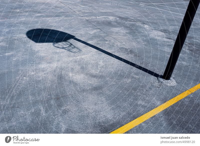 basketball hoop shadow on the basketball court street basket silhouette sunlight ground sports court field sports field floor equipment sports equipment game