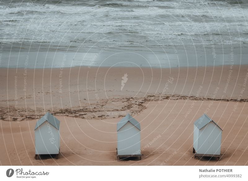 Wooden beach cabin on the sand sea ocean wave top view three sea ​​side holidays france cote d'opale Le Portel