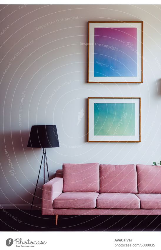 Modern composition of living room interior with brown mock up poster frame.Square wooden frame mock up with sofa and green plants on white wall in living room