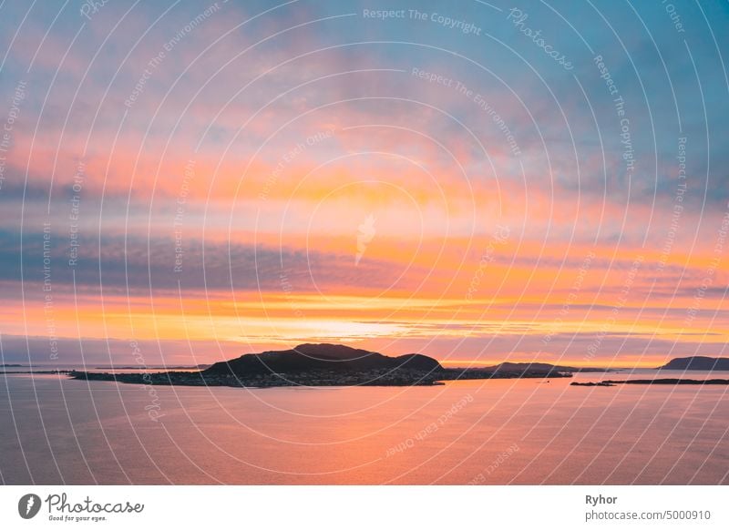 Alesund, Norway. Amazing Natural Bright Dramatic Sky In Warm Colours Above Alesund Valderoya And Islands In Sunset Time. Colorful Sky Background. Beauty In Norwegian Nature