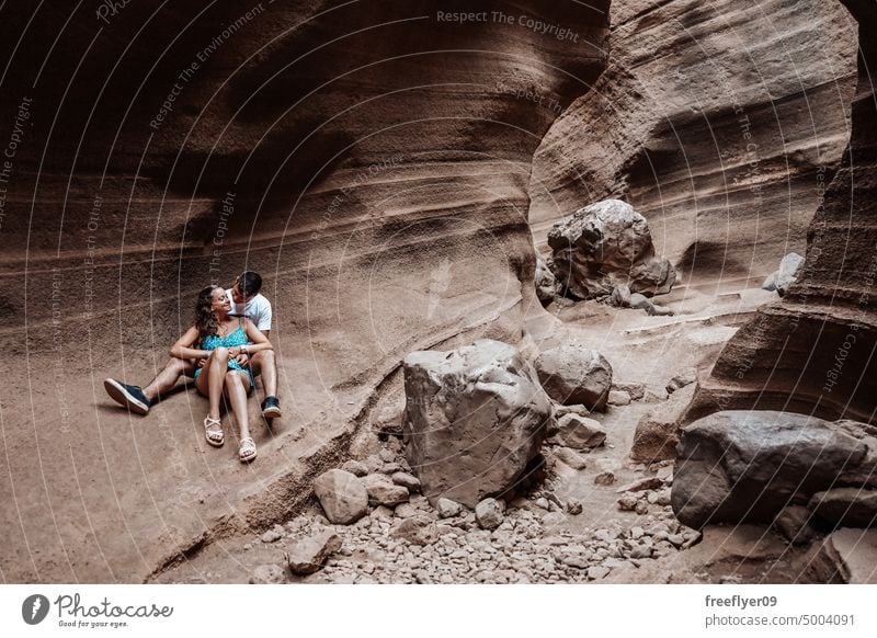 Young couple on their honeymoon young heterosexual woman blue barranco vacas cave volcanic spain copy space geological travel geology erosion canyon nature