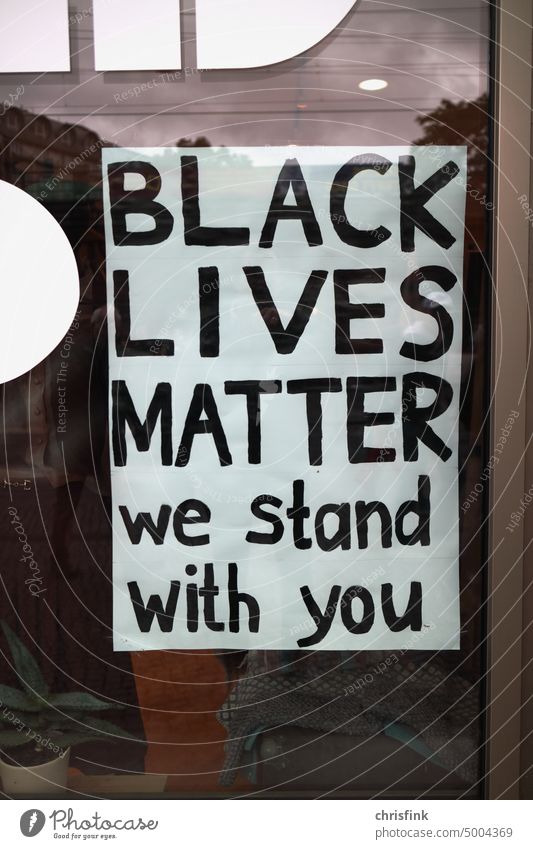 Black Lives Matter sign in shop window black Racism Solidarity Society Demonstration Human rights Fairness Humanity human dignity Signs and labeling