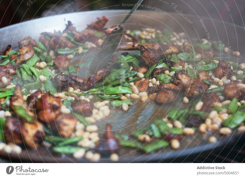 Appetizing dish with chicken and beans in pan stir cook food meal frying pan kitchen delicious meat dinner tasty daylight prepare appetizing gastronomy culinary