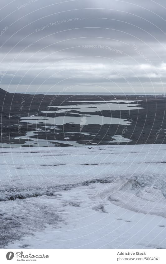 Glacier near mountains on cloudy day glacier ridge winter snow ice cold landscape breathtaking iceland vatnajokull national park sky weather terrain season