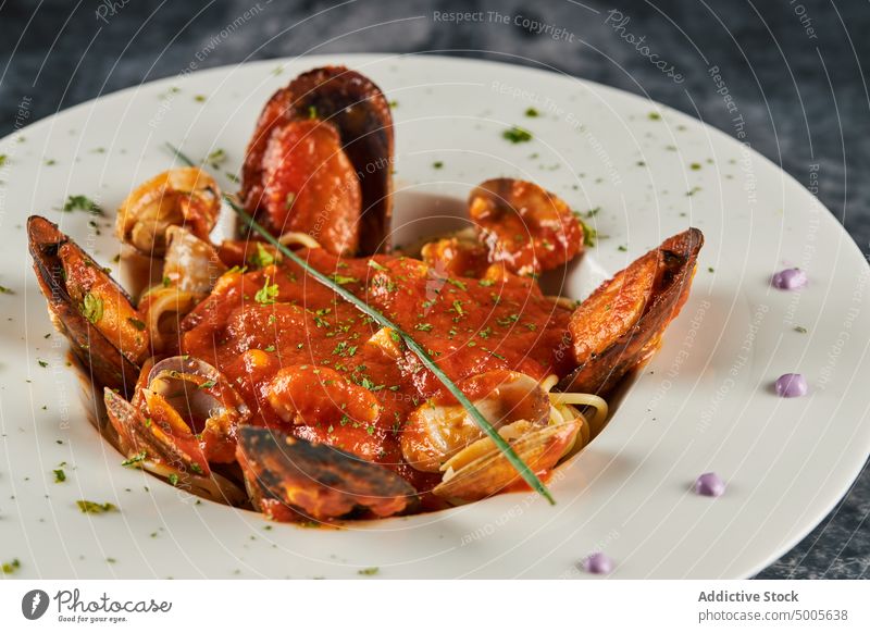 Spaghetti ai frutti di mare on plate spaghetti ai frutti di mare seafood sauce tomato italian cuisine restaurant serve pasta dish mussel prawn clam calamari