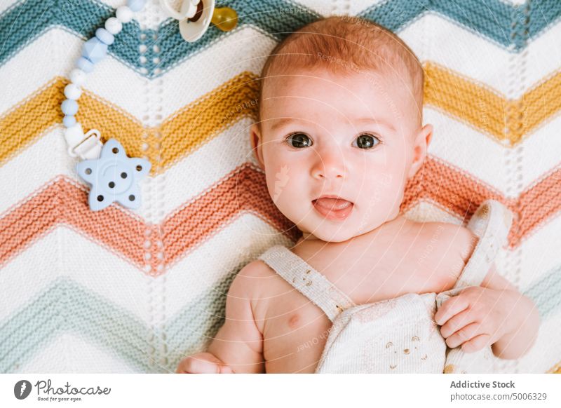 Calm cute baby resting in crib bed relax kid infant calm home child tranquil curious bedroom interest innocent babyhood plaid serene charming carefree shirtless