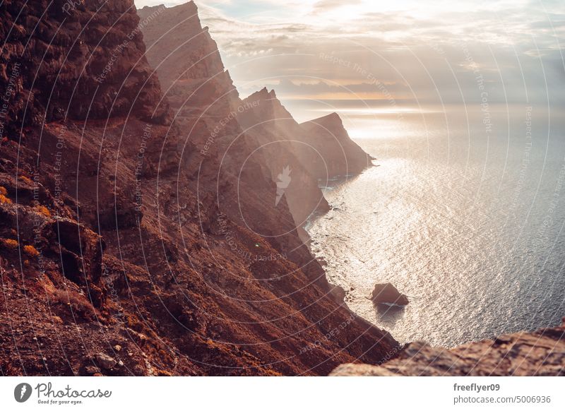 Volcanic cliff over the sea copy space volcanic rocks canary islands spain ocean black sky nobody trip creek place coast coastline canarian touristic africa