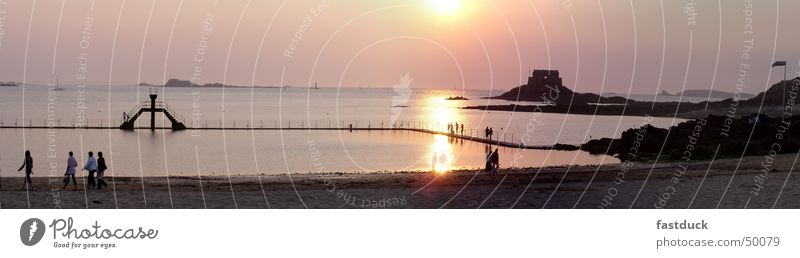 Sunset at St. Malo Summer Beach Ocean Staint-Malo France Brittany Yellow Fortress Springboard Low tide Water Rock Swimming & Bathing High tide Island