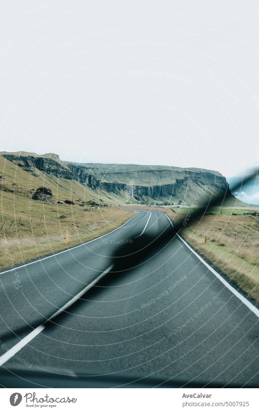 Focus on view from inside camper van on amazing cinematic scandinavian landscape. Travel on epic road trip through mountains.vanlife lifestyle. Life on the road