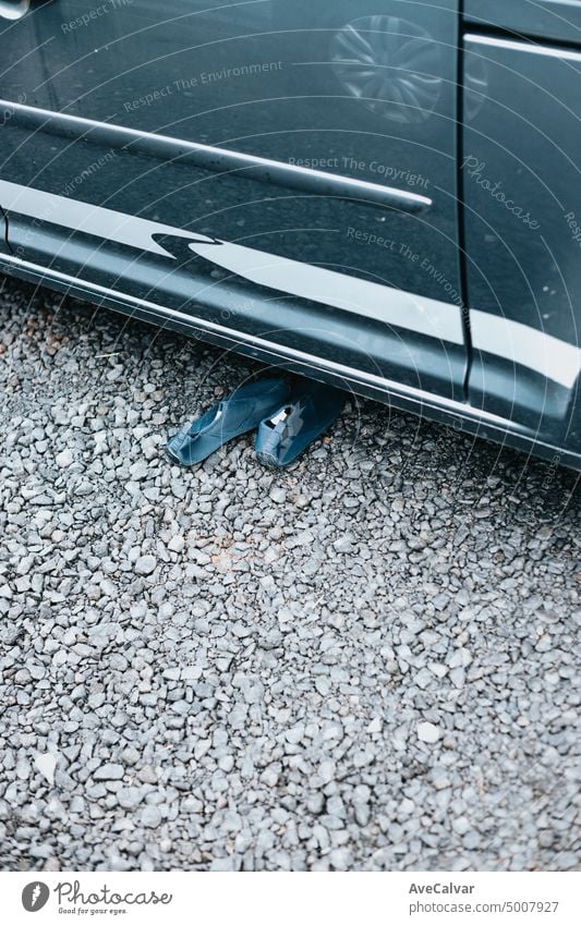 shoes next to a van door. stuff ready to start the route traveling across iceland. Sleeping outdoors, camping and exploring auto automobile bonding boys crowded