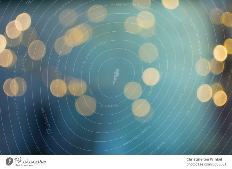 Golden light dots against blue background bokeh lights golden light light points Dream shine blurriness out Illuminate Esthetic Shallow depth of field Warmth