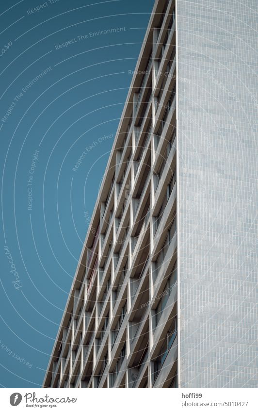 diagonal view of facade against blue sky Tower block Exterior Block High-rise Facade Symmetry High-rise facade Architecture Balcony