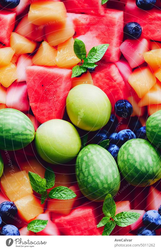 Colorful fruit salad. watermelon and melon salad. fresh summer food. close up freshness vitamin banana strawberry assorted fiber juicy kiwi colourful mixed