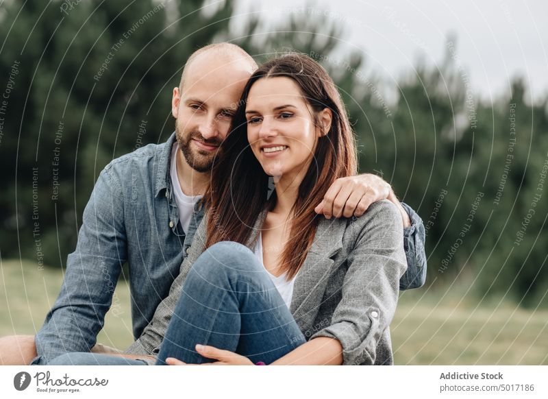 Lovely couple bonding and looking away embrace park walk happy together romantic hugging cheerful nature amorous dating embracing relationship fun casual smile