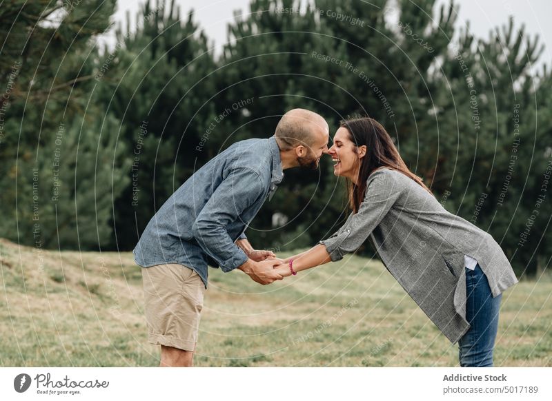 Loving couple playing in the mountain woman outdoors love people fun young adult holiday nature summer affectionate feeling females loving relation togetherness