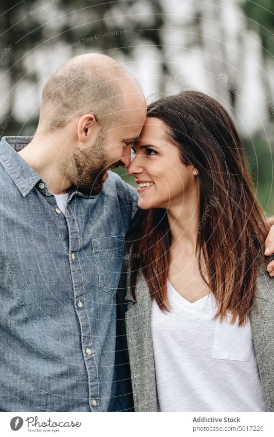 Tranquil lovers embracing in park couple cuddle enamored tranquil closed eyes embrace casual clothes boyfriend date romance together calm girlfriend hugging